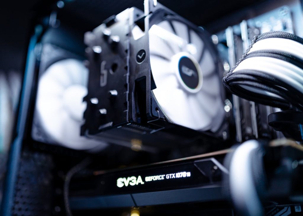 Hello world! Detailed view of a cooling fan inside a modern gaming PC setup.